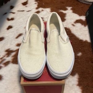 Vans cream slip on sneakers.